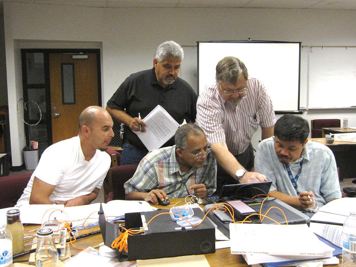 Optical Fiber training: Clockwise from left: Samuel Campos (District 6), Richard Montoya (District 10), Eric Pearson, Dave Le (District 6), Berhanu Zergaw (District 3).