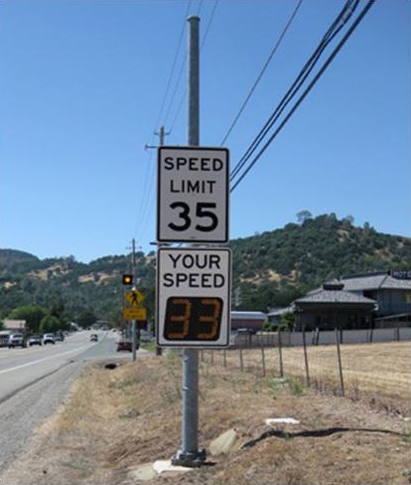 Permanent mount radar speed sign along a stretch of highway where the posted speed limit is 35 miles per hour.