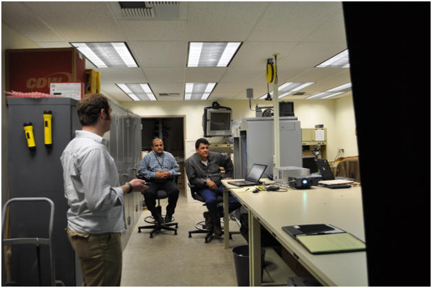 Kelvin Bateman listening to comments during the presentation with Mohammed Battah (left) and Ian Turnbull (right) sitting in the background. The meeting was held in Ian's lab.