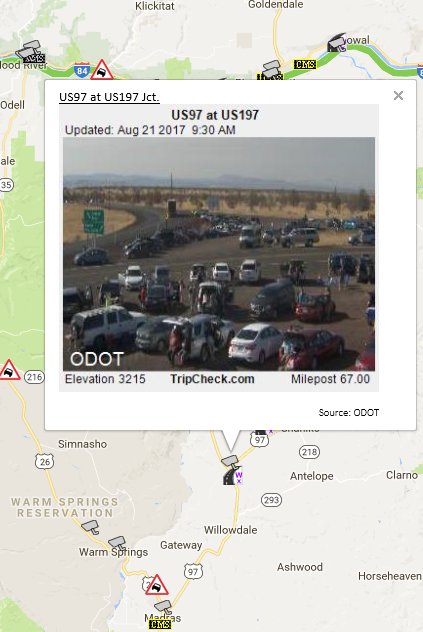 Cars parked along US 97 at US 197 north of Madras, Oregon.