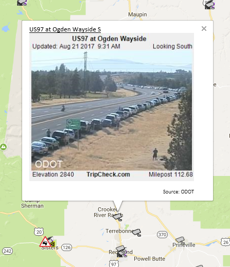 Long line of cars parked along US 97 at Ogden Wayside, between Redmond and Madras, Oregon.