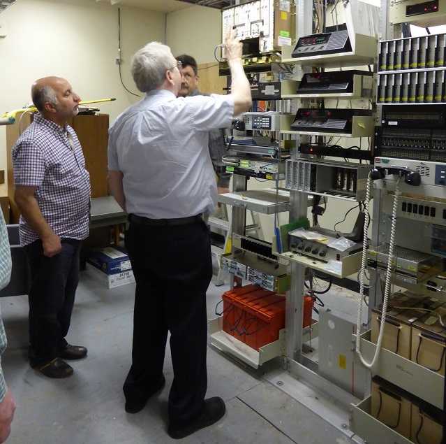 Clockwise from left:  Ihab Elzaanoun (Caltrans District 6), Ian Turnbull (Caltrans District 2), and instructor Scott Baxter in the radio equipment room at the Woodland Maintenance Yard.
