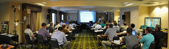 Participants at the 2015 Forum listen to a technical presentation.