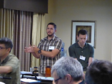 Bryan Prestel (left), discusses a point made during one of the presentations at the 2017 Forum.