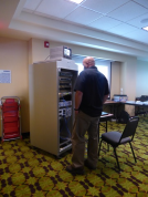 Jim Whalen from the Nevada DOT examines Caltrans District 2’s ITS Node Equipment Cabinet.