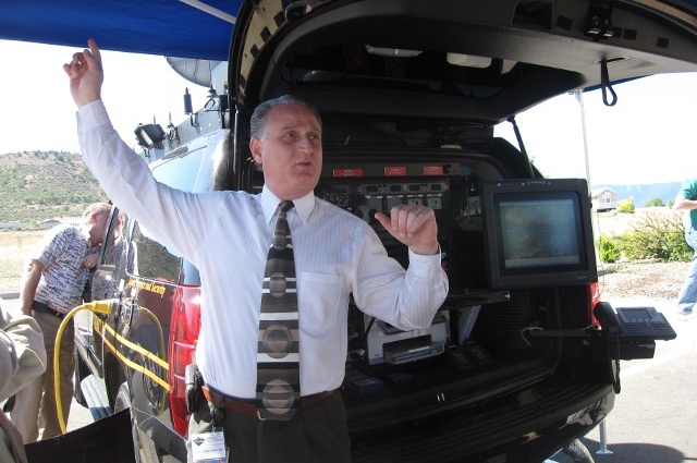 John Batarseh points to the satellite dish mounted on the roof of the RRV as he demonstrates the RRV’s capabilities.