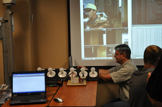 Sean Campbell demonstrating a remote power controller system with telephone and internet control functions.