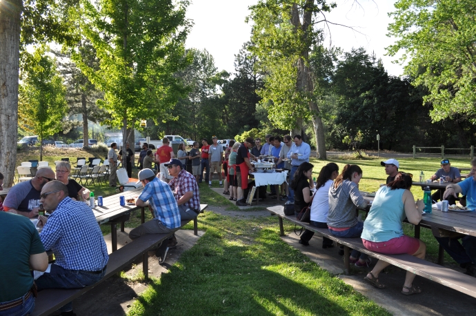 Forum participants network in the park during the Wednesday night BBQ.