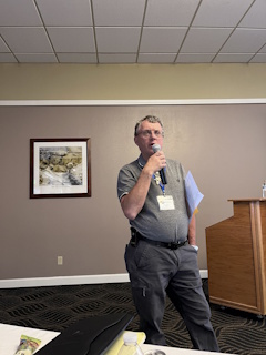A man speaking into a microphone.