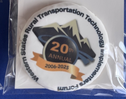 Packaged cookie, round, Forum logo mountain, 20th ANNUAL, 2006-2026 ribbon, 'Western States Rural Transportation Technology Implementers Forum' around the outside edge.